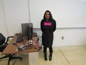 Rajani Muraleedharan, assistant professor of Electrical and Computer Engineering at Saginaw Valley State University, with one of the drones involved in her experiment that may someday be used for autonomous exploration of Saturn's moon Titan.